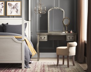 Bedroom scene with vanity and small upholstered seat